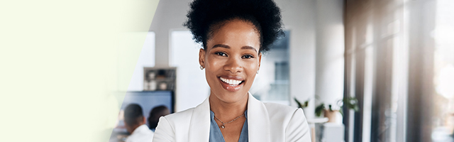 Smiling professional in a classroom setting looking at the camera